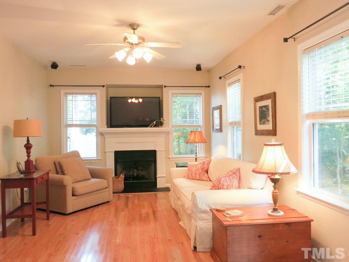 4629 Landover Crest Drive Raleigh, NC 27616 - Photo 6 of 25 The spacious Living Rm features a gas log FP w/TV niche above, hardwood floor, surround sound, CF & lots of windows.