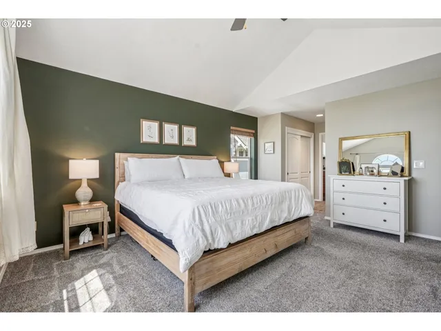 a spacious bedroom with a bed and window