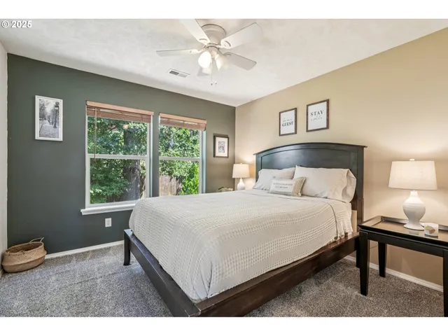 a bedroom with a bed and a table