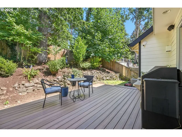 a view of a backyard with a sitting area