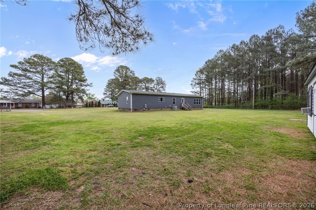 2252 Old Stage Road South Erwin, NC 28339 - Photo 38 of 47 a backyard of a house with lots of green space