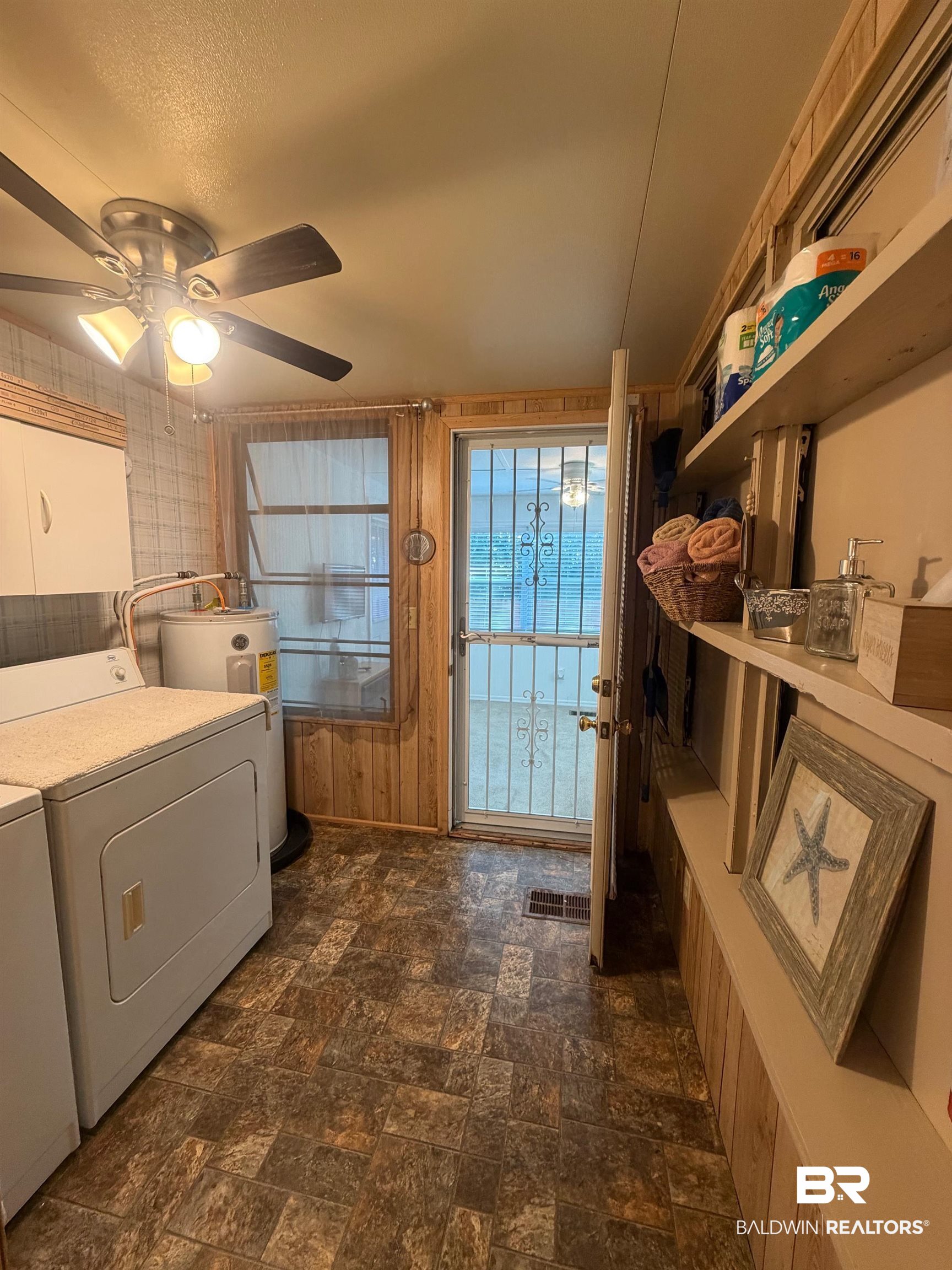 685 Escambia Loop Lillian, AL 36549 - Photo 18 of 43 Laundry area featuring ceiling fan, electric water heater, and washer and clothes dryer
