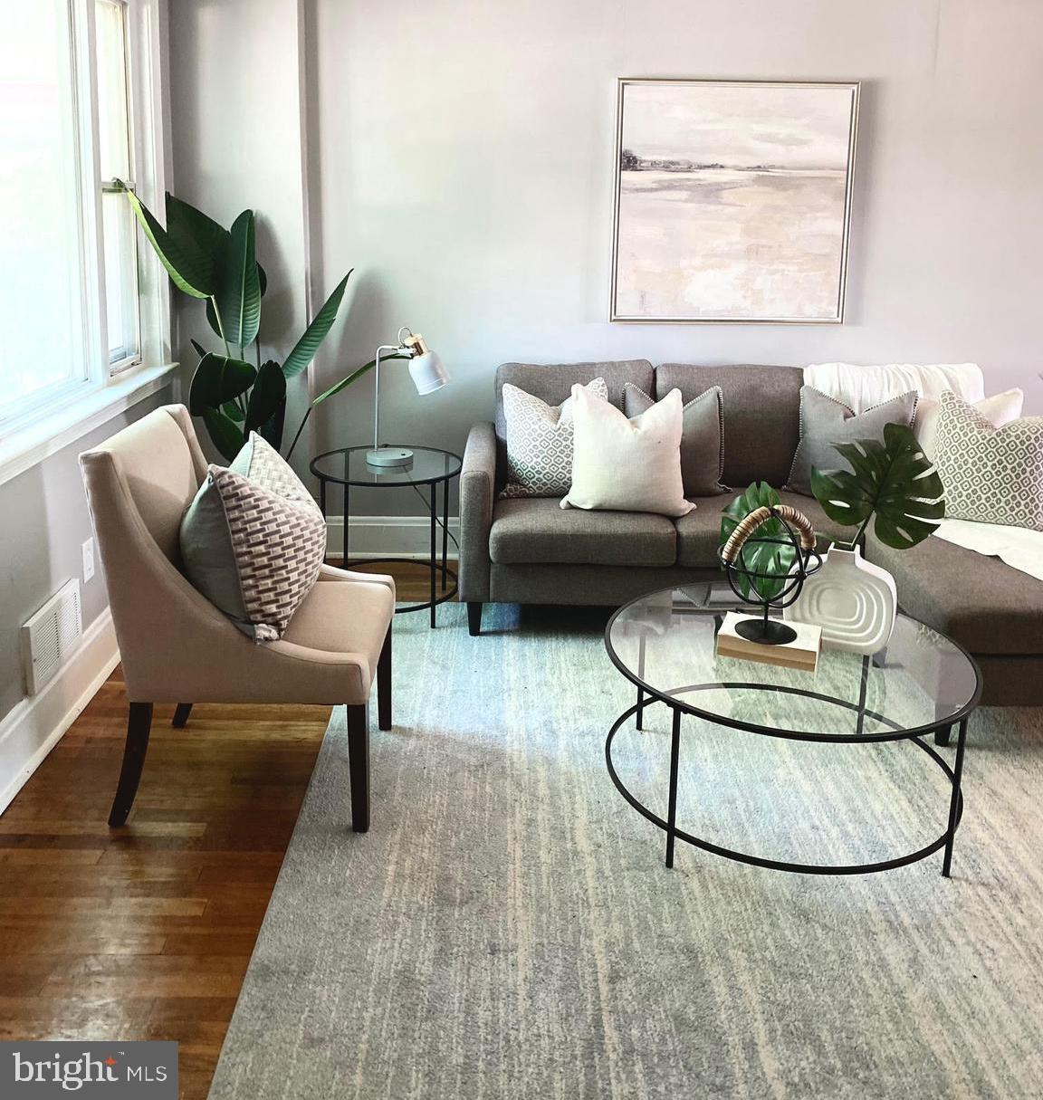 a living room with furniture and a table