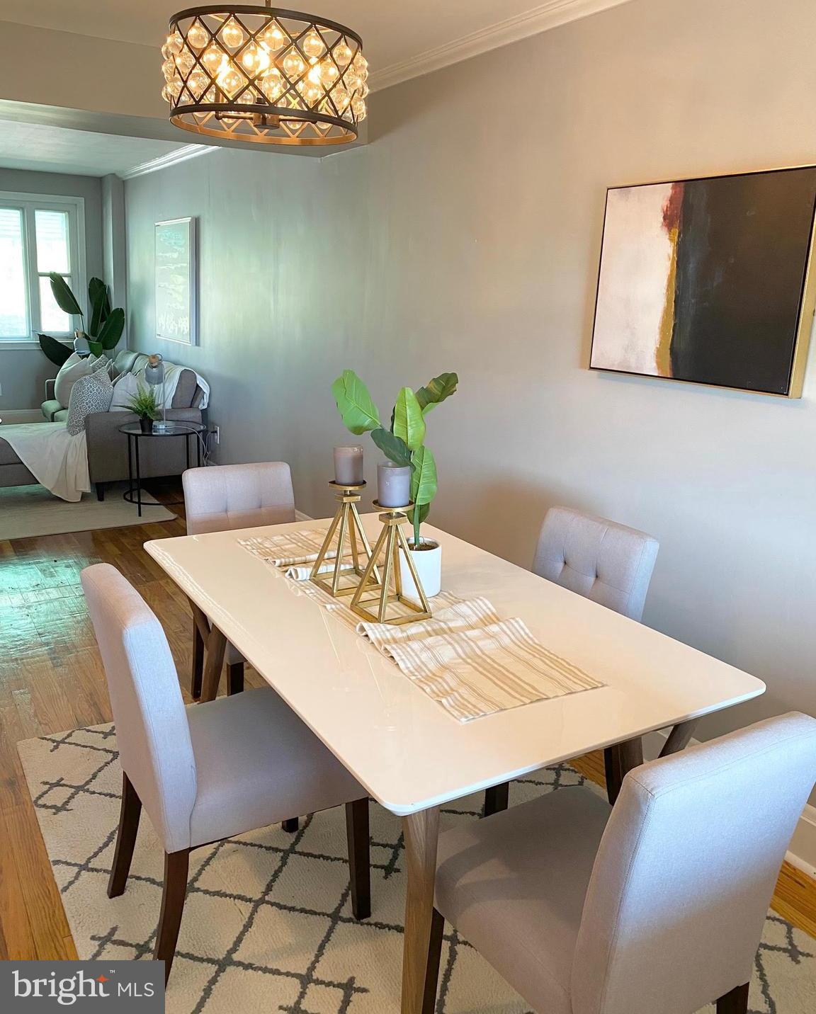 5019 Schaub Avenue Baltimore, MD 21206 - Photo 16 of 34 a view of a dining room with furniture and wooden floor