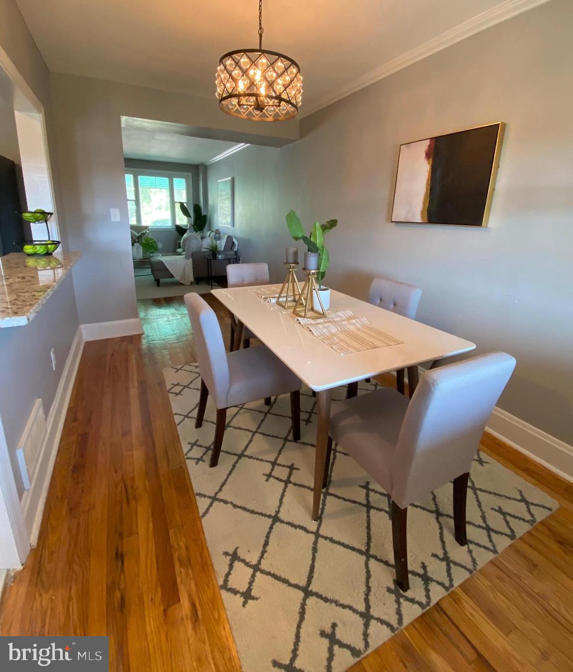 5019 Schaub Avenue Baltimore, MD 21206 - Photo 17 of 34 a view of a dining room with furniture and chandelier