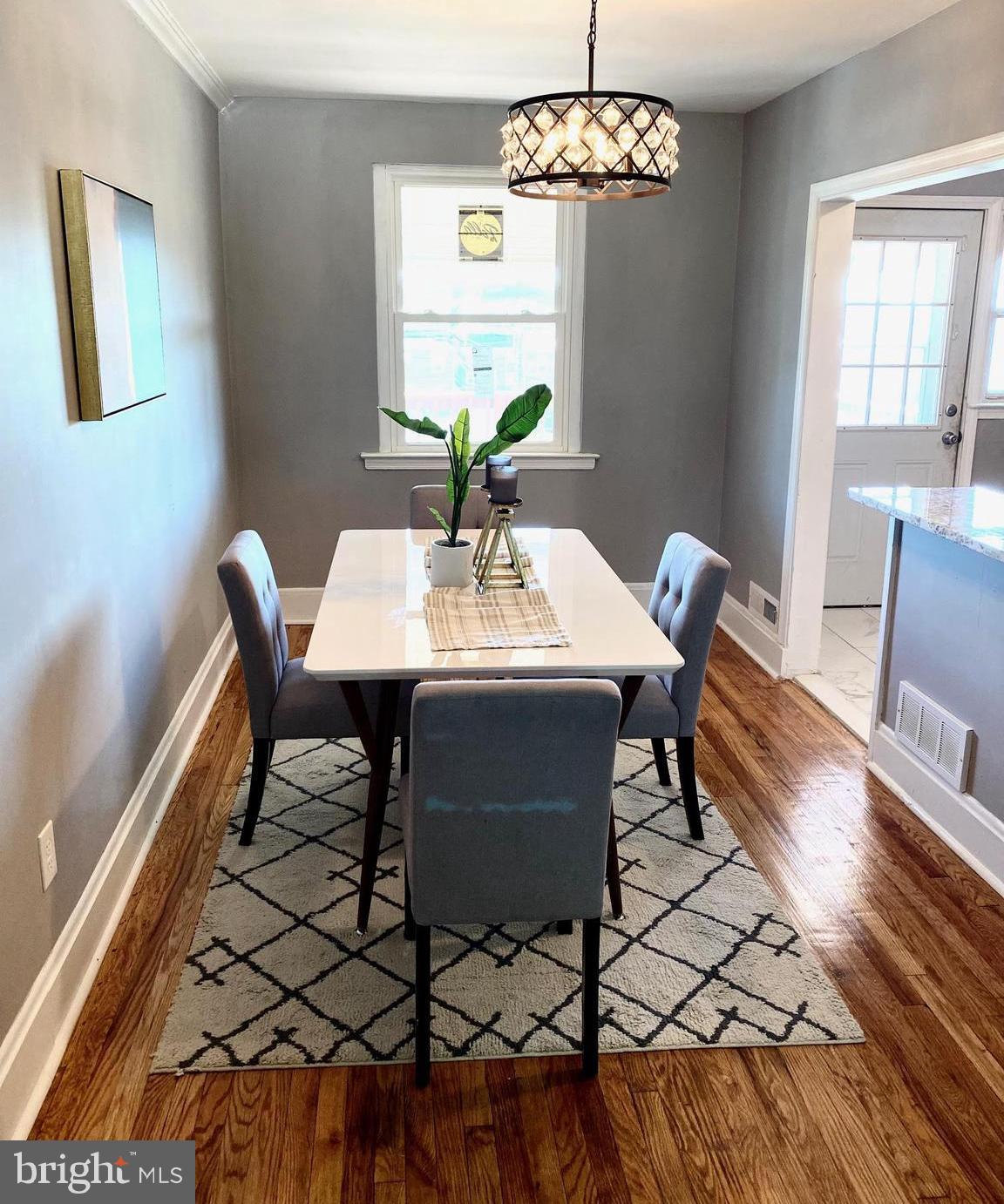 5019 Schaub Avenue Baltimore, MD 21206 - Photo 18 of 34 a view of a dining room with furniture and chandelier