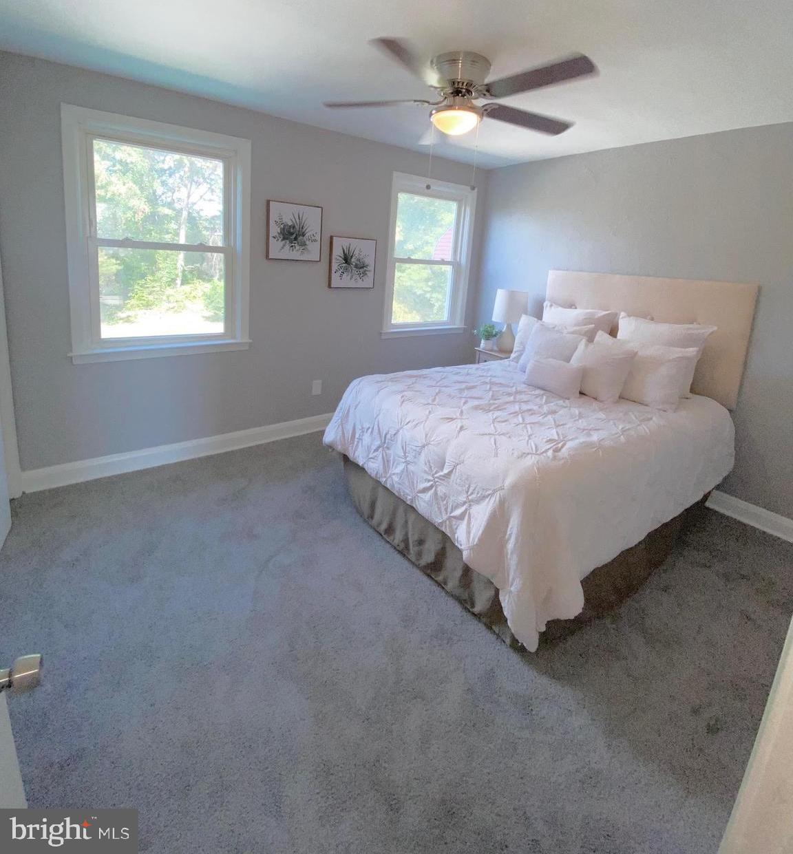 5019 Schaub Avenue Baltimore, MD 21206 - Photo 19 of 34 a large bed sitting in a bedroom next to a window