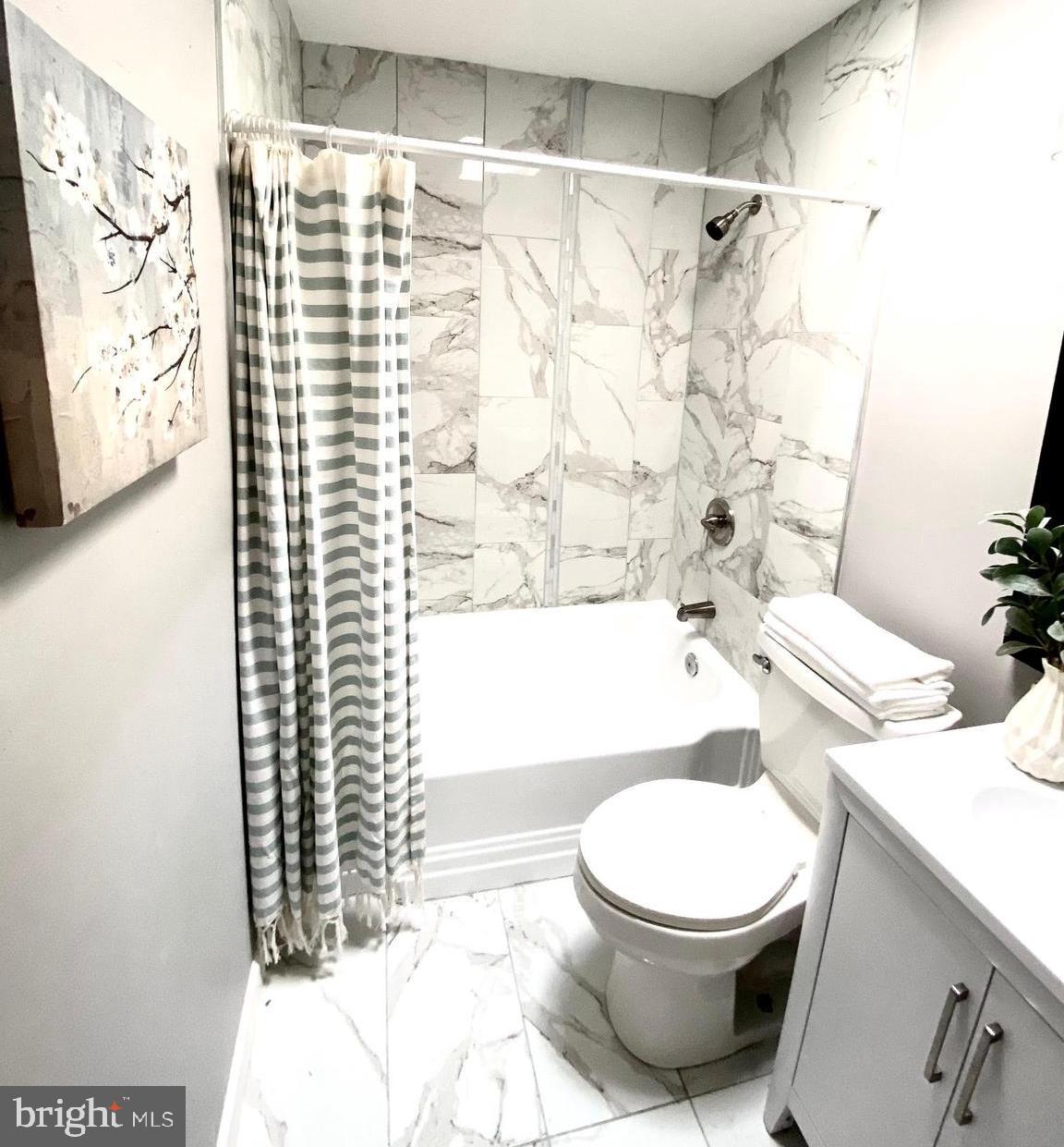 5019 Schaub Avenue Baltimore, MD 21206 - Photo 21 of 34 a white toilet sitting next to a bath tub