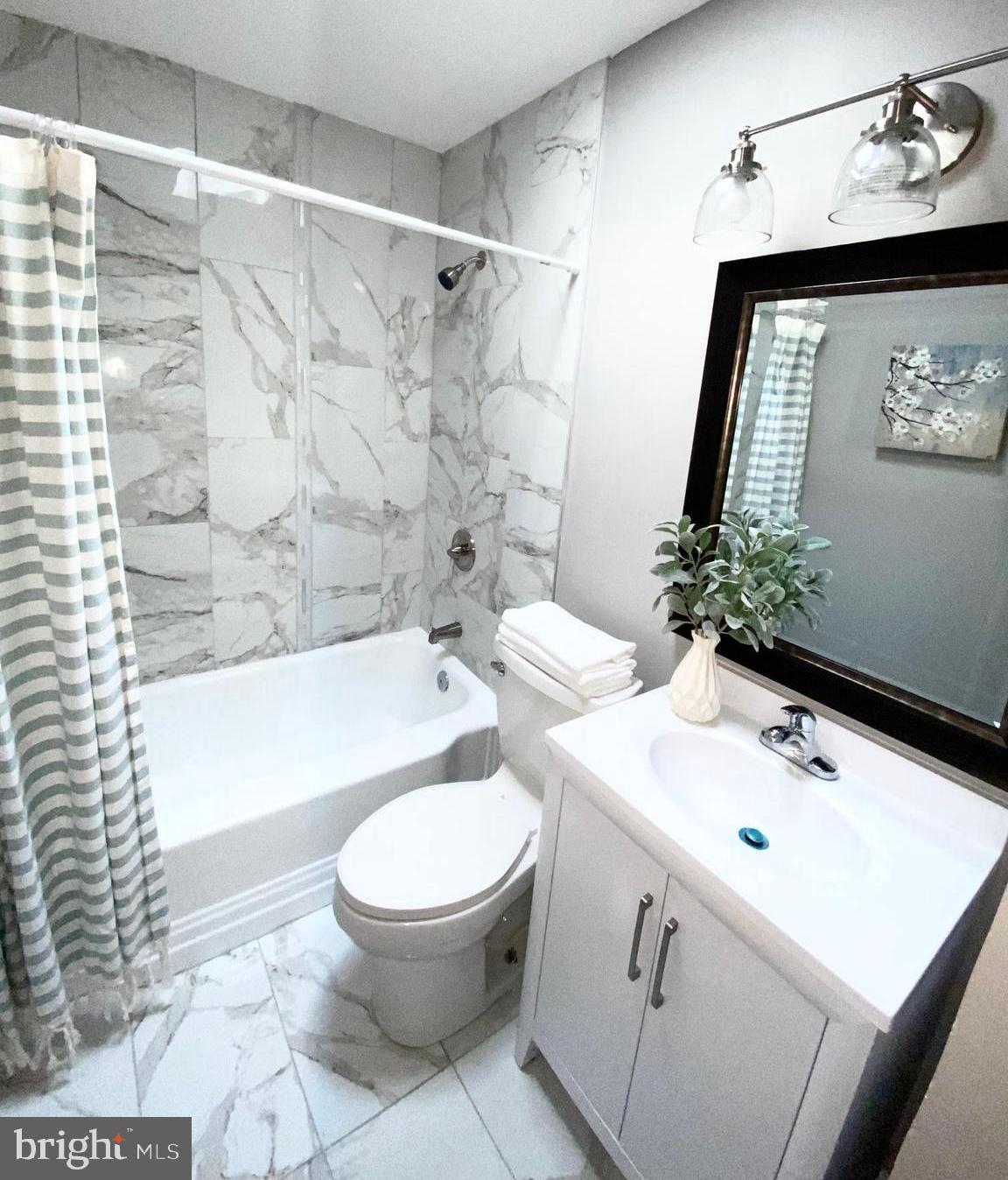 5019 Schaub Avenue Baltimore, MD 21206 - Photo 23 of 34 a bathroom with a sink toilet and shower