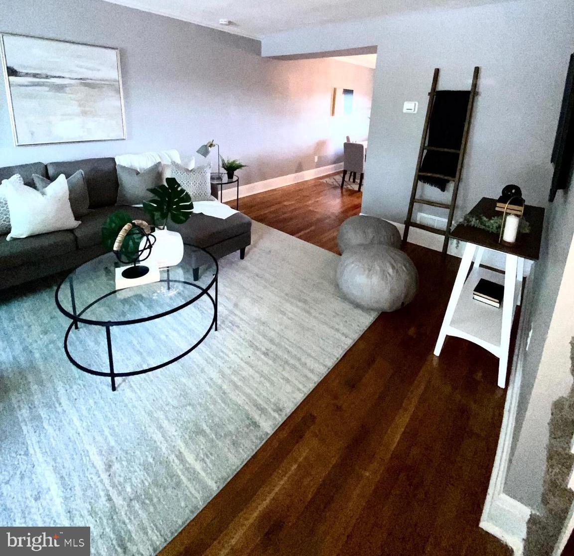 5019 Schaub Avenue Baltimore, MD 21206 - Photo 6 of 34 a living room with furniture and wooden floor
