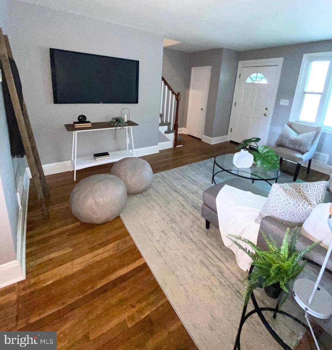 5019 Schaub Avenue Baltimore, MD 21206 - Photo 7 of 34 a living room with furniture and a flat screen tv