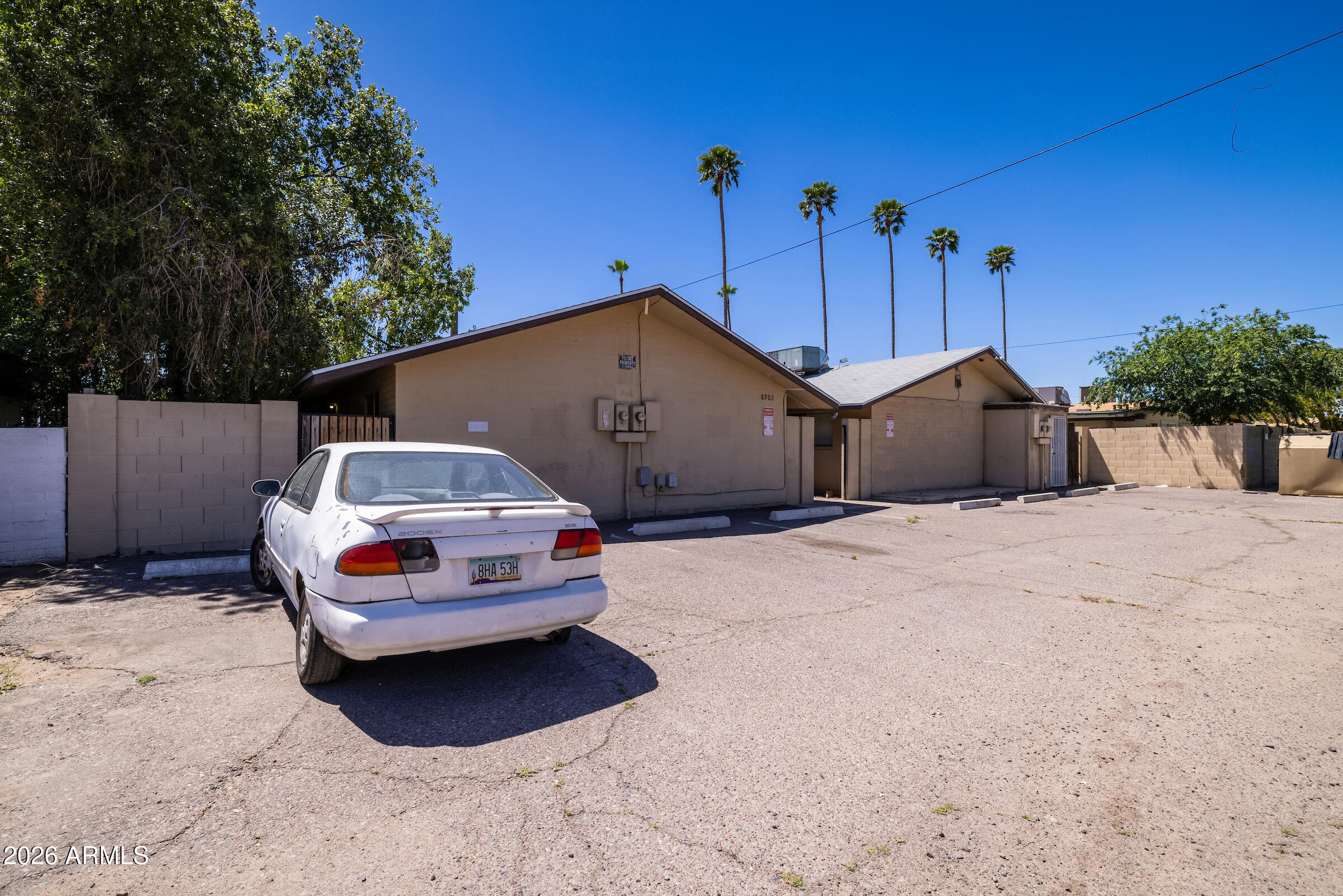 6702 East Cheery Lynn Road Scottsdale, AZ 85251 - Photo 5 of 5 a car parked in front of a house