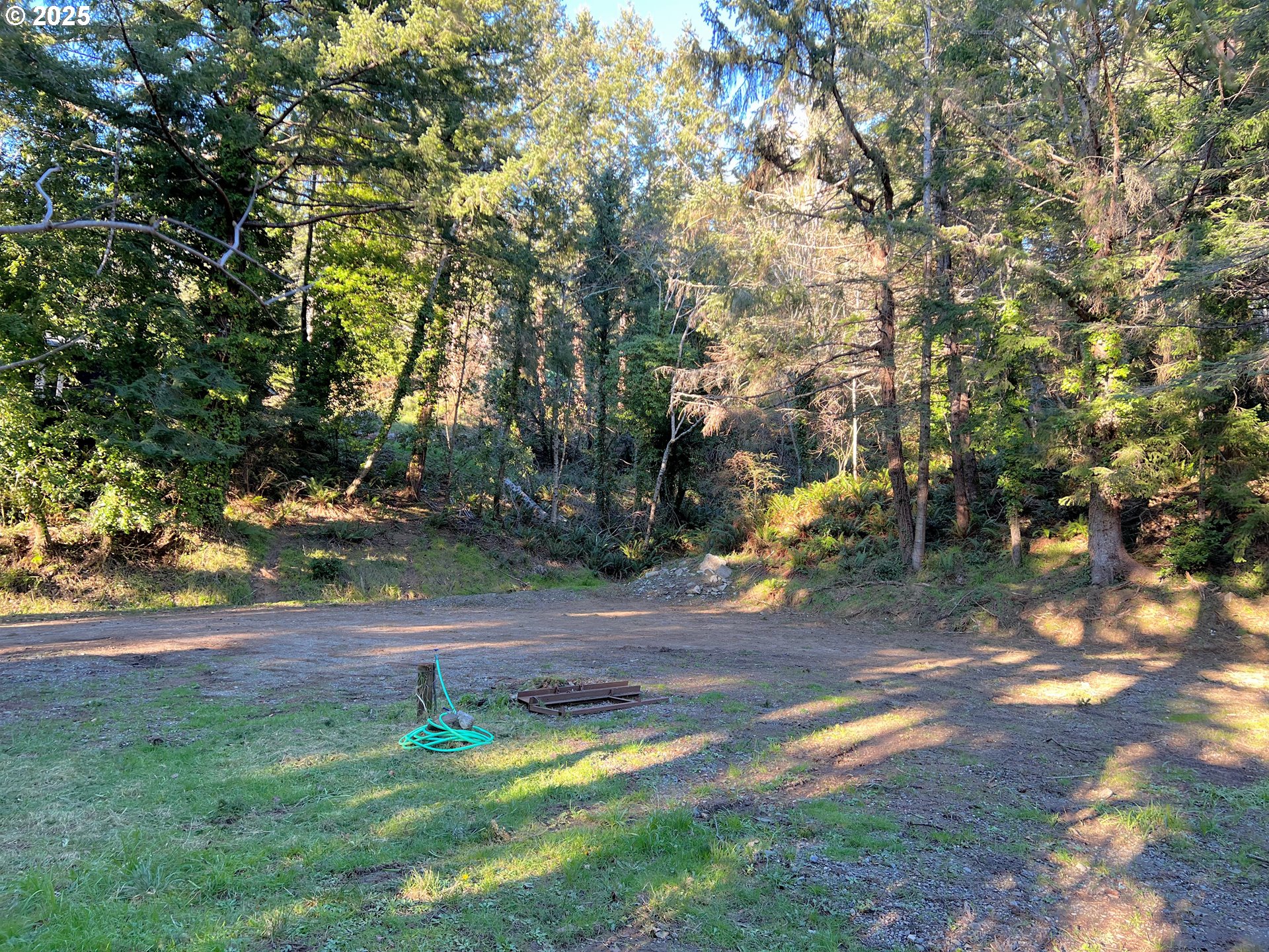 28397 Mateer Road Gold Beach, OR 97444 - Photo 14 of 17 a backyard of a house with lots of green space