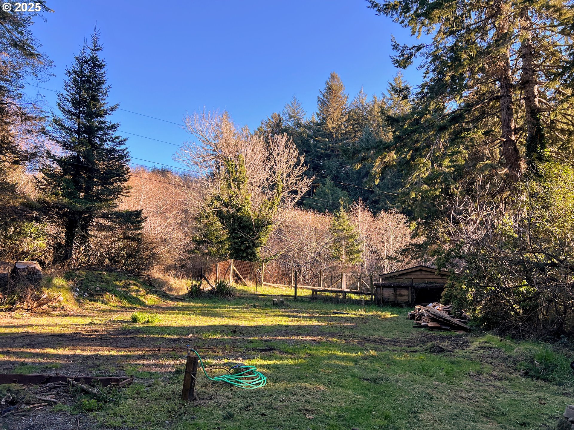 28397 Mateer Road Gold Beach, OR 97444 - Photo 16 of 17 a view of a house with a yard