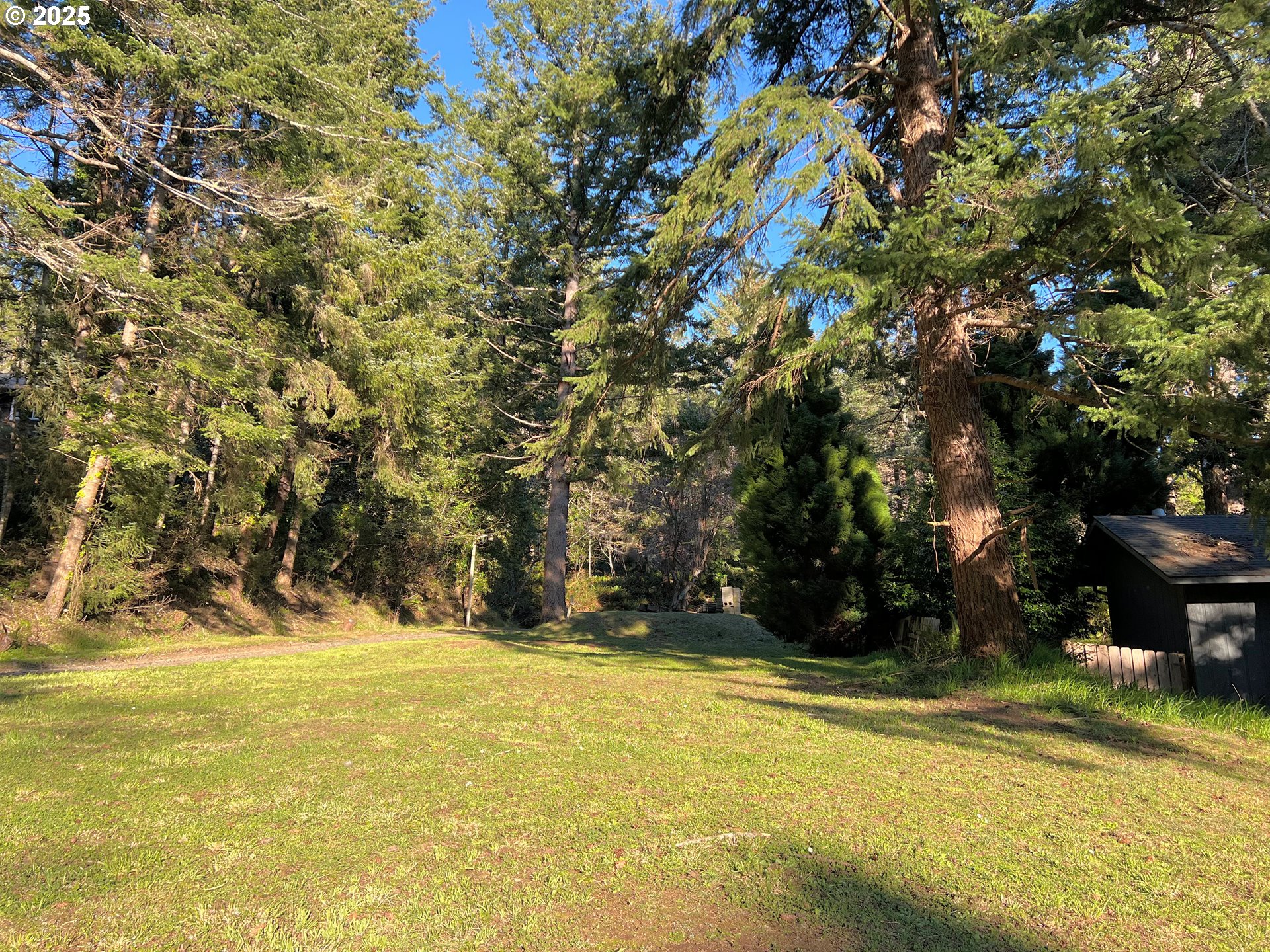 28397 Mateer Road Gold Beach, OR 97444 - Photo 3 of 17 a view of swimming pool with an outdoor space and seating