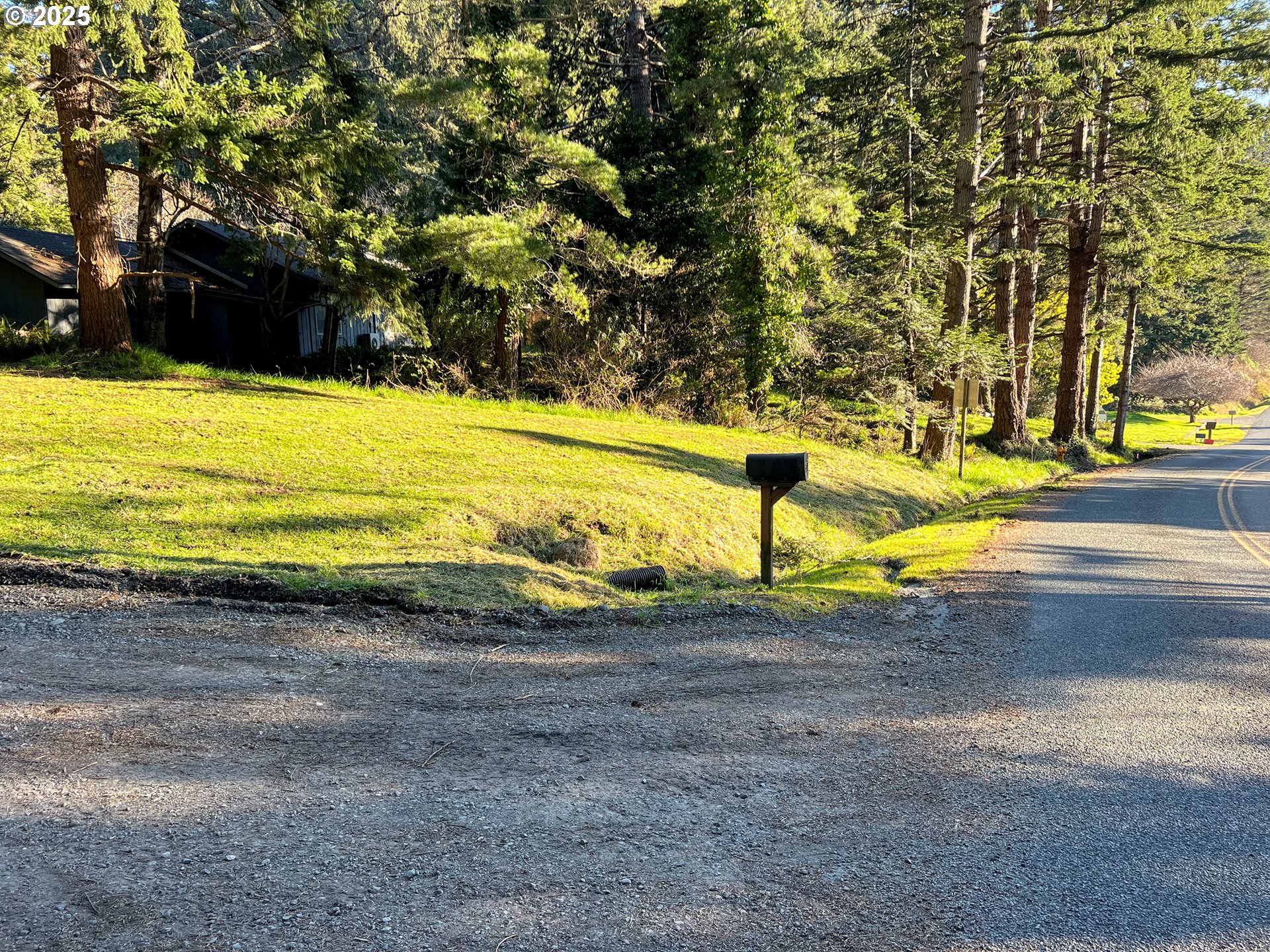 28397 Mateer Road Gold Beach, OR 97444 - Photo 5 of 17 a view of an ocean with large trees