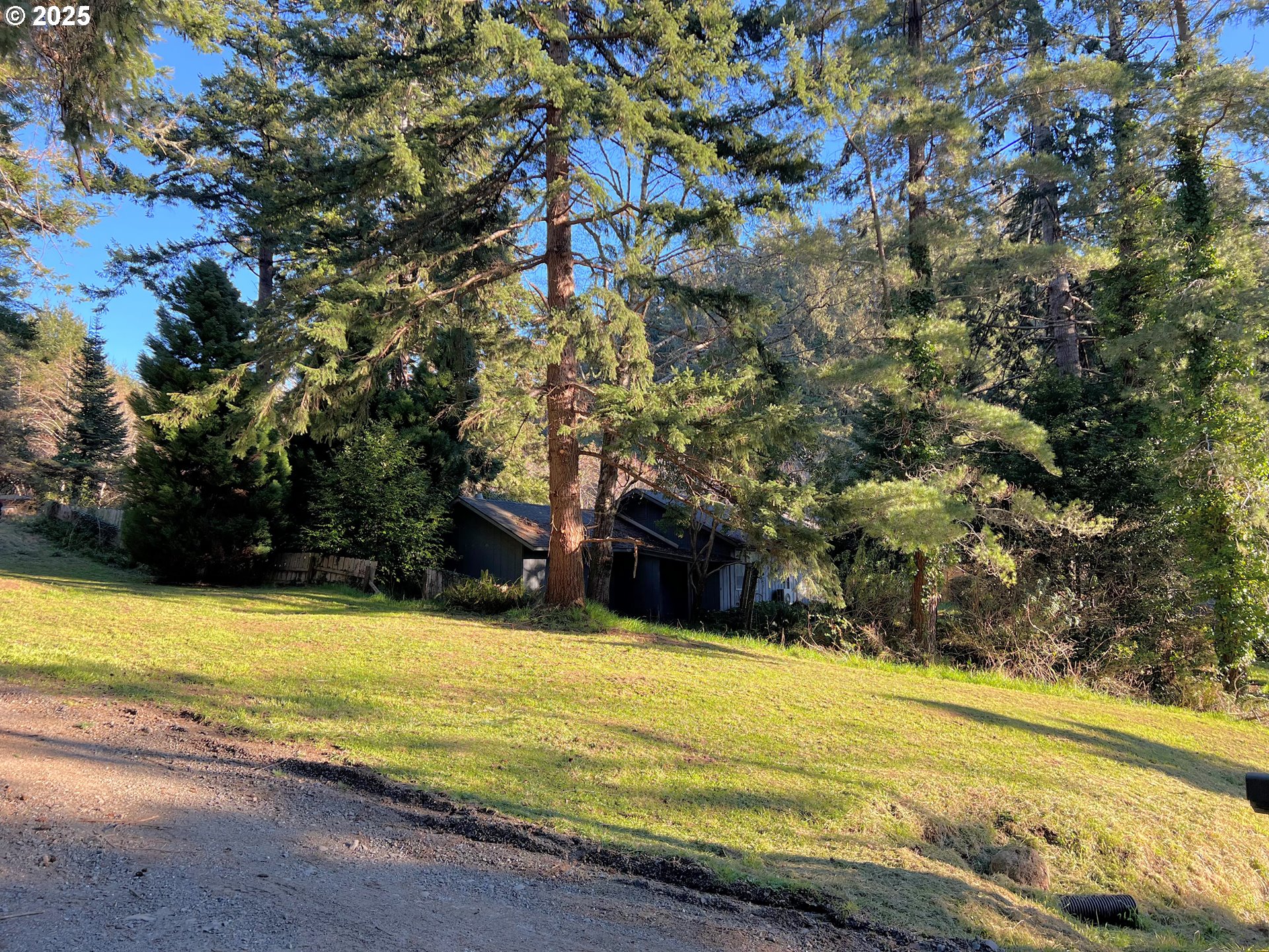 28397 Mateer Road Gold Beach, OR 97444 - Photo 6 of 17 a swimming pool with an outdoor space and seating area