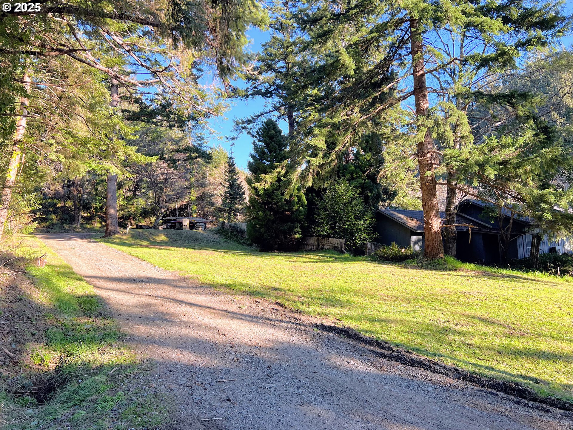28397 Mateer Road Gold Beach, OR 97444 - Photo 7 of 17 a view of an outdoor space and swimming pool