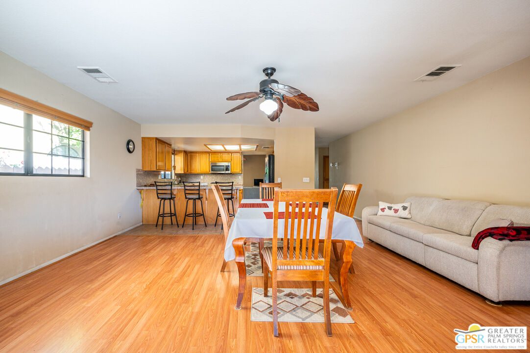 68655 Durango Road Cathedral City, CA 92234 - Photo 12 of 36 a living room with furniture and wooden floor