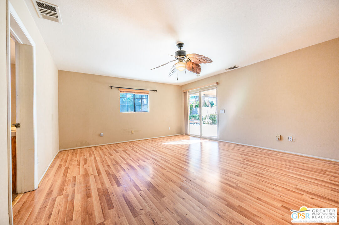 68655 Durango Road Cathedral City, CA 92234 - Photo 17 of 36 a view of empty room with wooden floor and fan