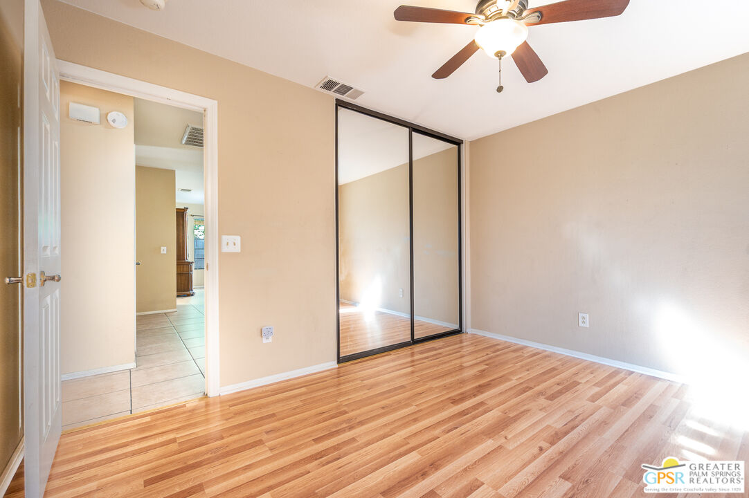 68655 Durango Road Cathedral City, CA 92234 - Photo 19 of 36 a view of an empty room with wooden floor