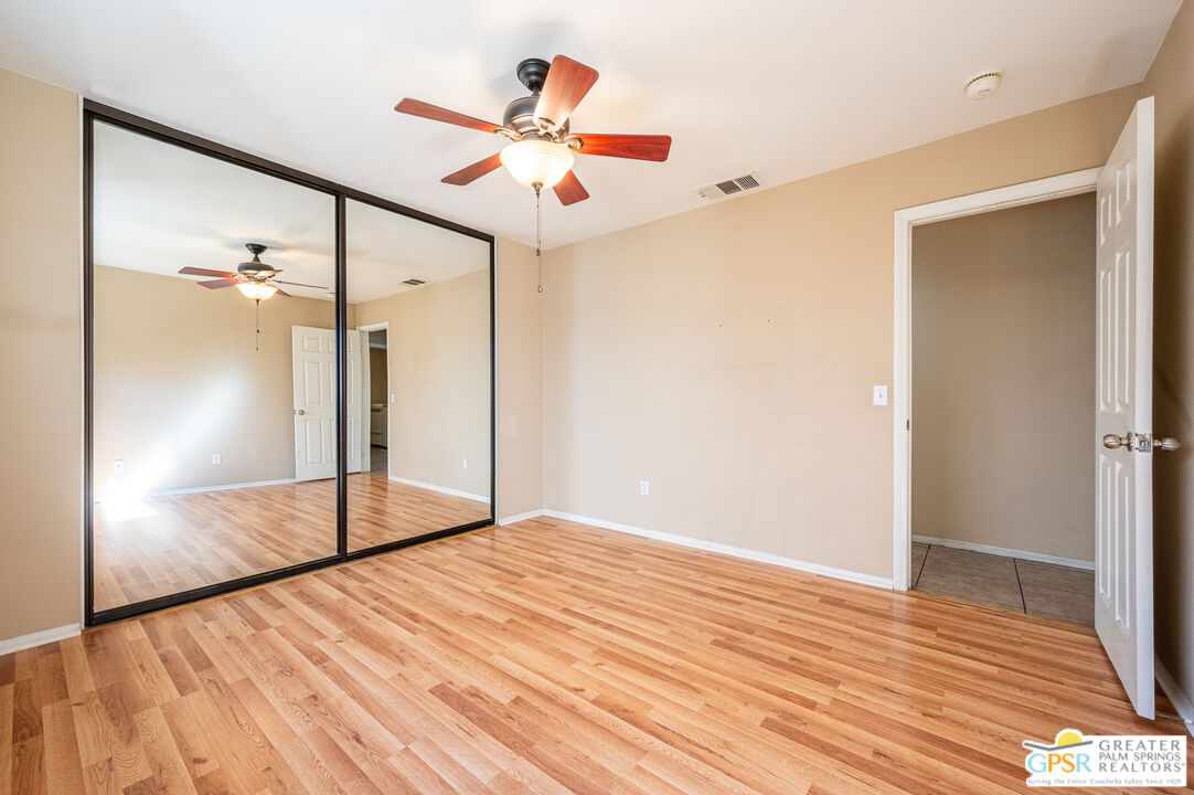 68655 Durango Road Cathedral City, CA 92234 - Photo 20 of 36 a view of empty room with wooden floor