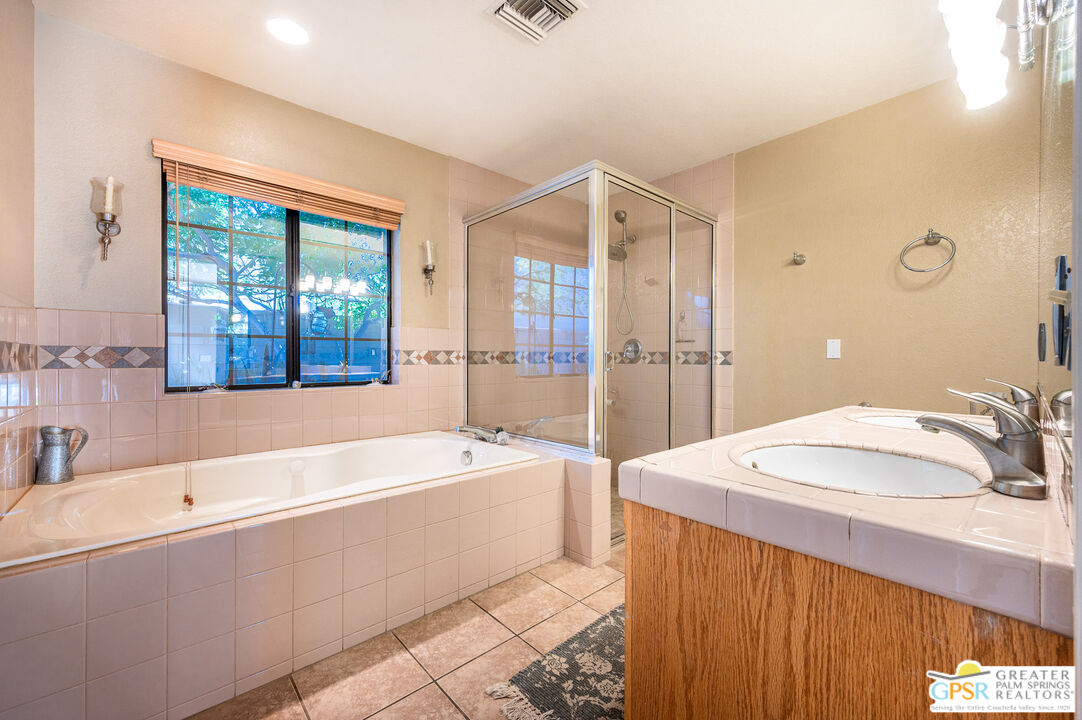 68655 Durango Road Cathedral City, CA 92234 - Photo 25 of 36 a spacious bathroom with sink shower and bathtub