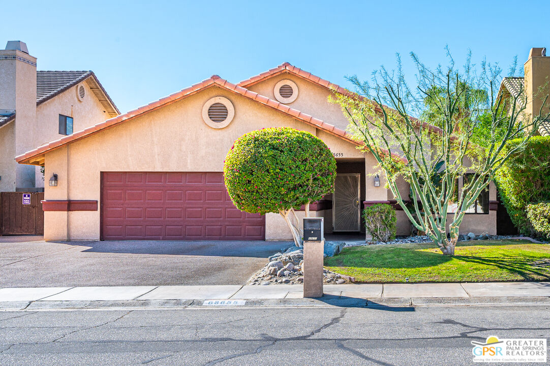 68655 Durango Road Cathedral City, CA 92234 - Photo 3 of 36 a front view of a house with a yard
