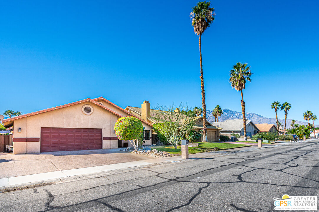 68655 Durango Road Cathedral City, CA 92234 - Photo 36 of 36 a front view of a house with a yard and a garage
