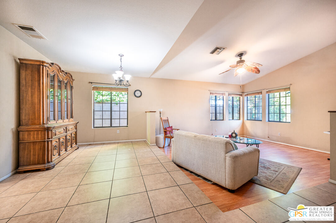 68655 Durango Road Cathedral City, CA 92234 - Photo 6 of 36 a living room with furniture and a chandelier