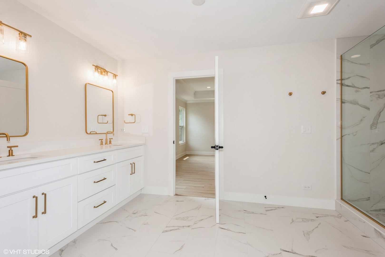 1N060 Morse Street Carol Stream, IL 60188 - Photo 11 of 17 a spacious bathroom with a double vanity sink mirror and double