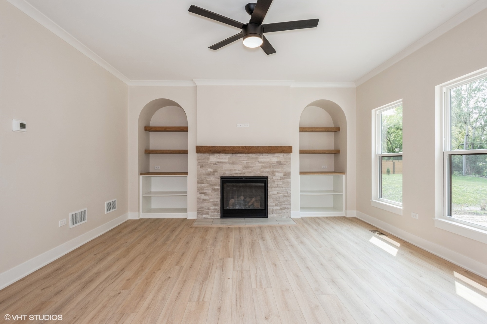 1N060 Morse Street Carol Stream, IL 60188 - Photo 7 of 17 wooden floor fireplace and windows in an empty room