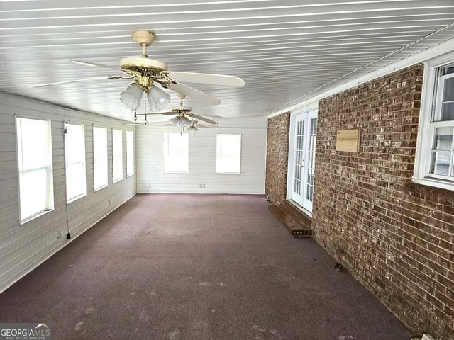 a view of an empty room and window