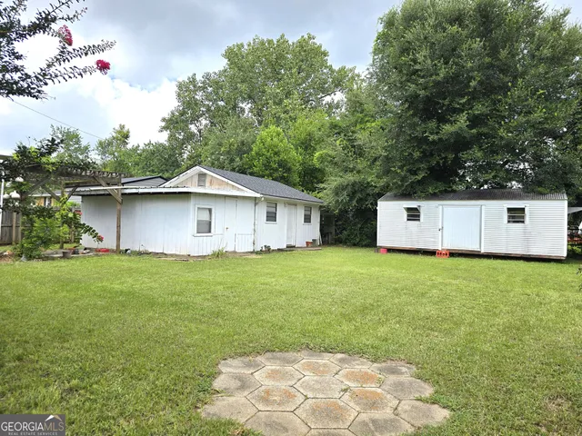 a house view with a backyard space