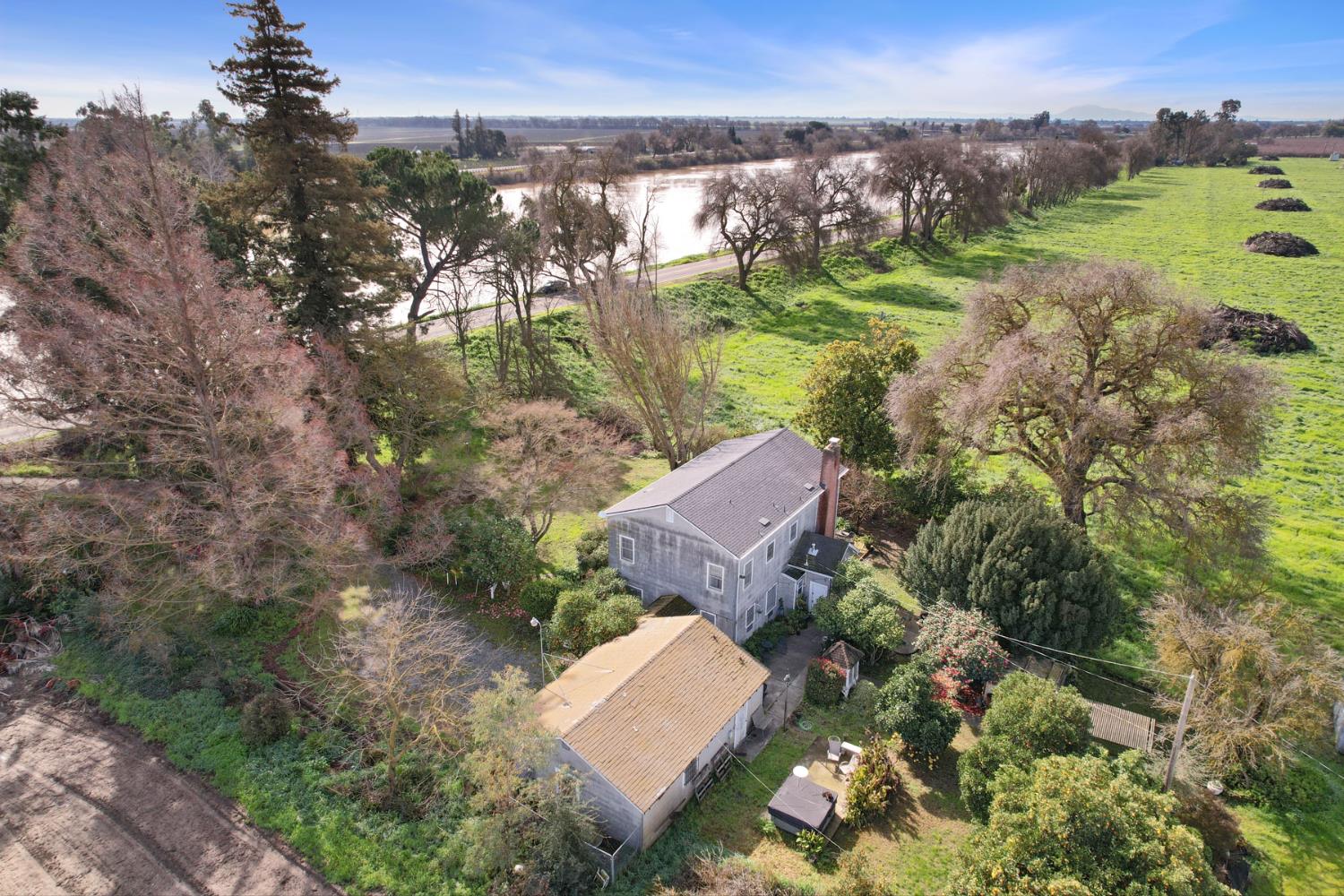 39670 South River Road Clarksburg, CA 95612 - Photo 13 of 85 an aerial view of a house with a yard and lake view