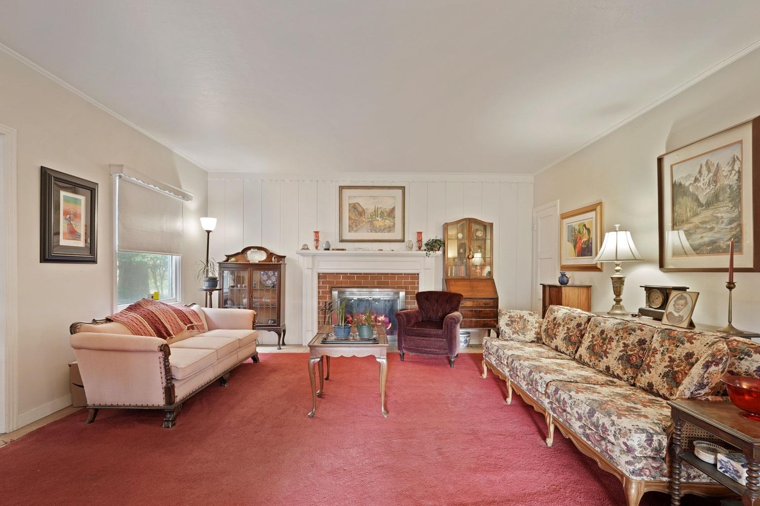 39670 South River Road Clarksburg, CA 95612 - Photo 26 of 85 a living room with furniture and a fireplace