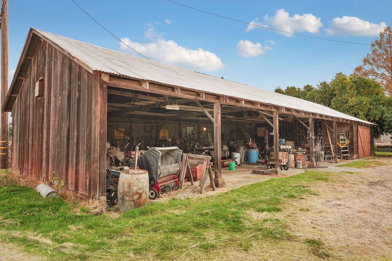 39670 South River Road Clarksburg, CA 95612 - Photo 48 of 85 a view of a backyard with table and chairs and potted plants