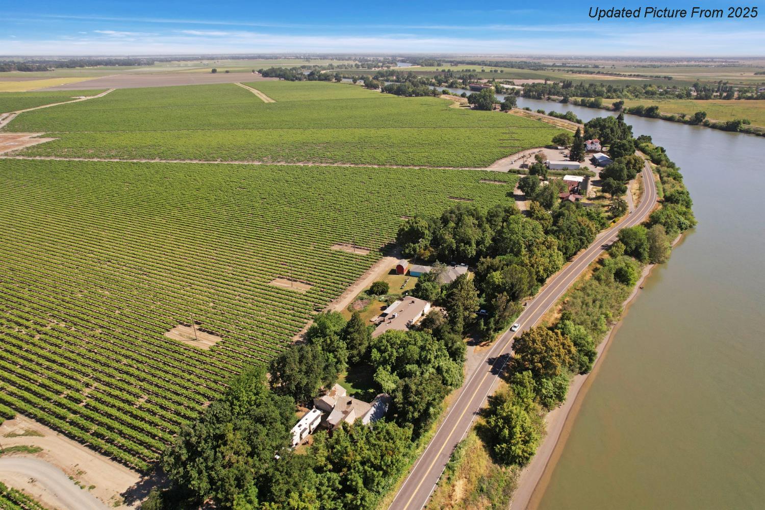 39670 South River Road Clarksburg, CA 95612 - Photo 58 of 85 a view of a large body of water with a building in the background