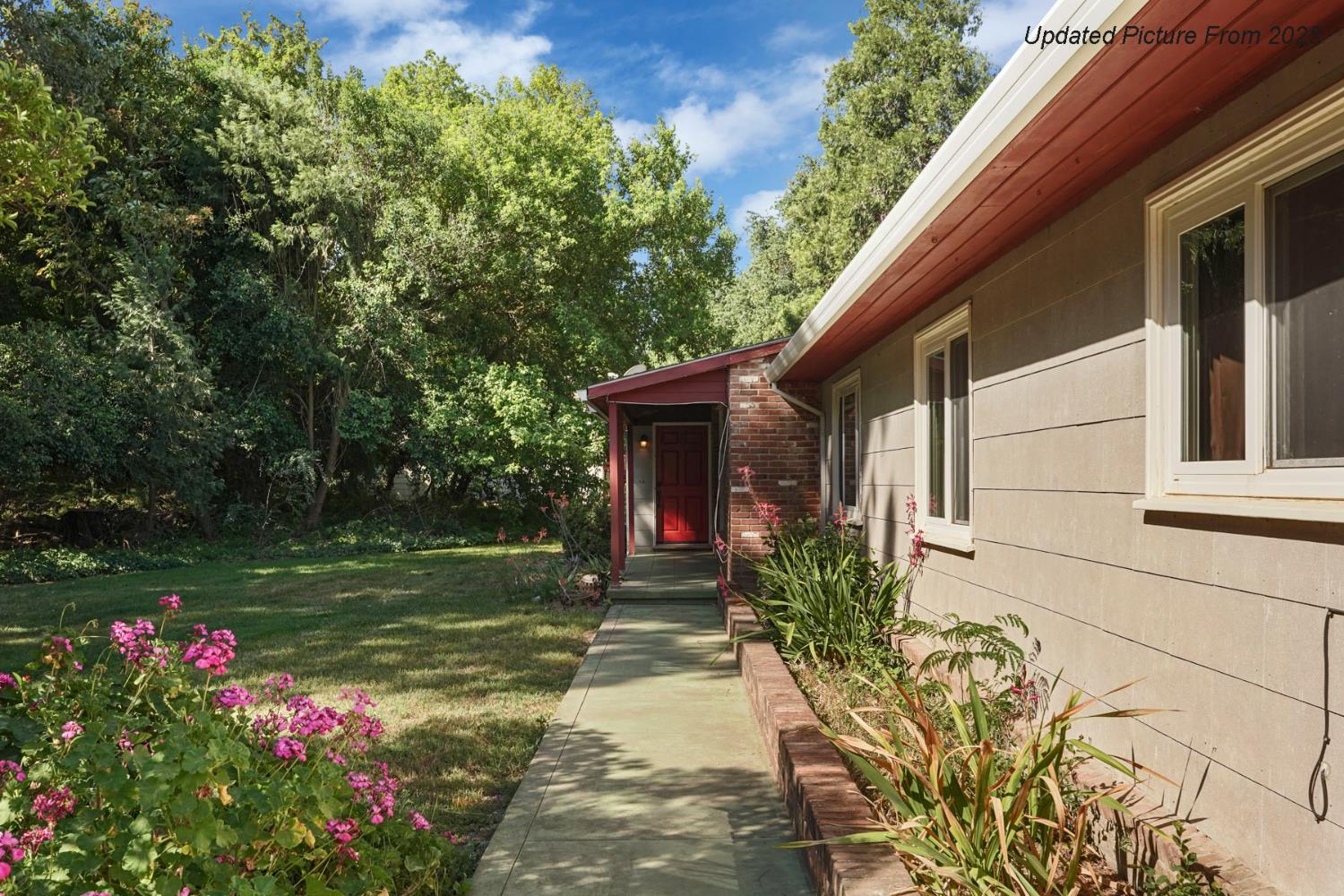 39670 South River Road Clarksburg, CA 95612 - Photo 65 of 85 a flower garden is sitting in front of a house