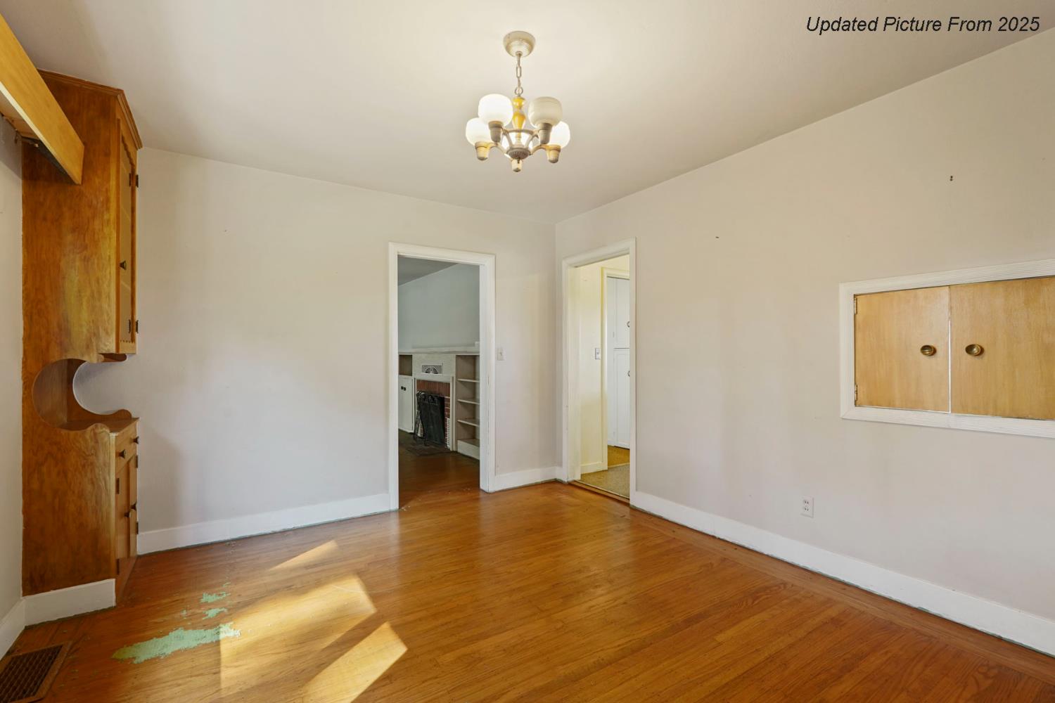 39670 South River Road Clarksburg, CA 95612 - Photo 70 of 85 a view of a hallway with wooden floor and a chandelier