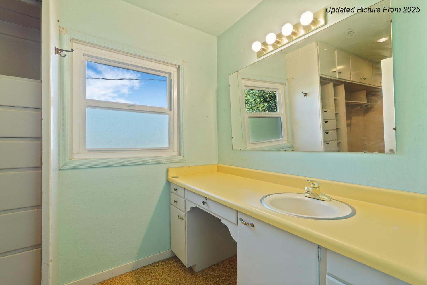 39670 South River Road Clarksburg, CA 95612 - Photo 80 of 85 a bathroom with a sink a vanity and a mirror