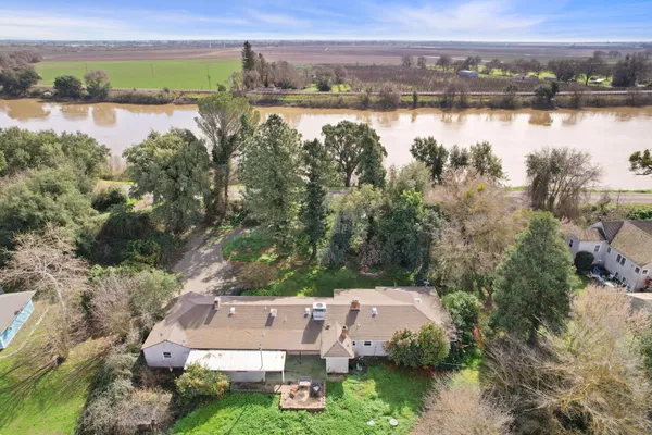 an aerial view of house with lake view