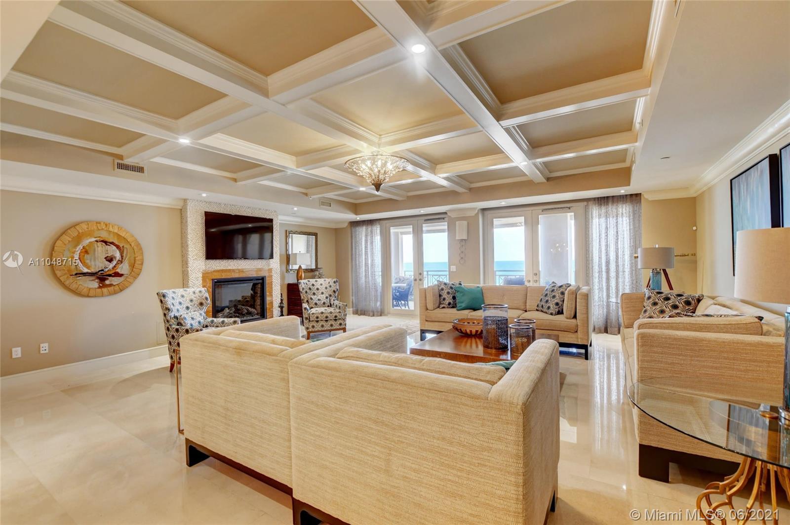 2500 South Ocean Boulevard, Unit 702 Boca Raton, FL 33432 - Photo 11 of 61 a living room with furniture and a flat screen tv