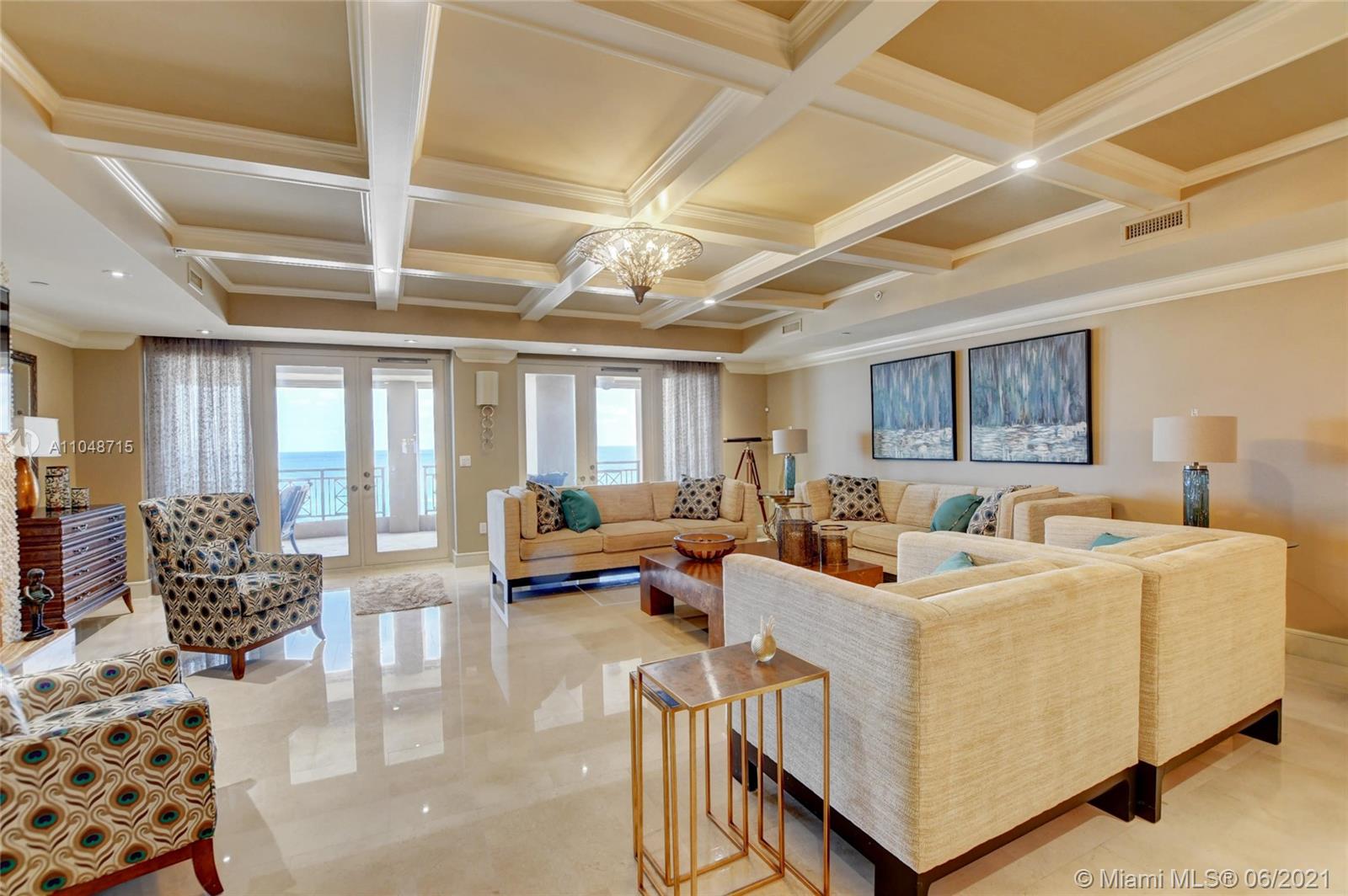 2500 South Ocean Boulevard, Unit 702 Boca Raton, FL 33432 - Photo 12 of 61 a living room with furniture and a large window