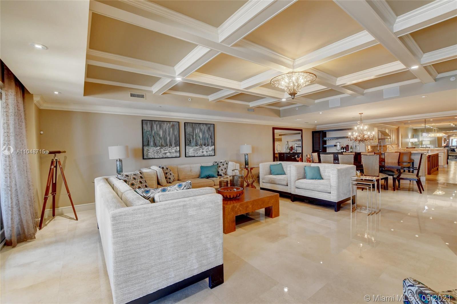 2500 South Ocean Boulevard, Unit 702 Boca Raton, FL 33432 - Photo 13 of 61 a living room with furniture and a flat screen tv