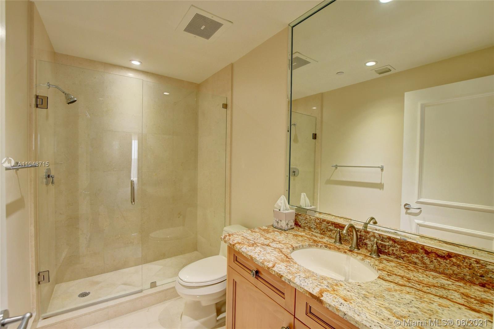 2500 South Ocean Boulevard, Unit 702 Boca Raton, FL 33432 - Photo 14 of 61 a bathroom with a granite countertop sink toilet and shower