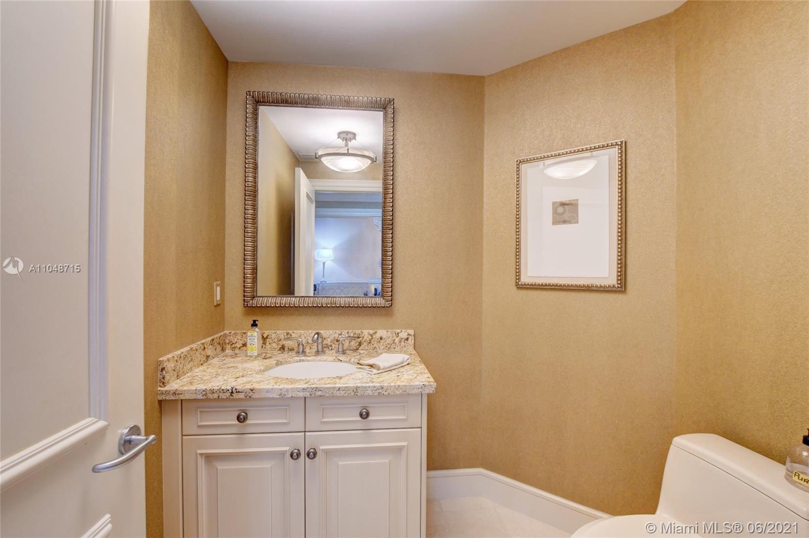 2500 South Ocean Boulevard, Unit 702 Boca Raton, FL 33432 - Photo 22 of 61 a bathroom with a sink and a mirror