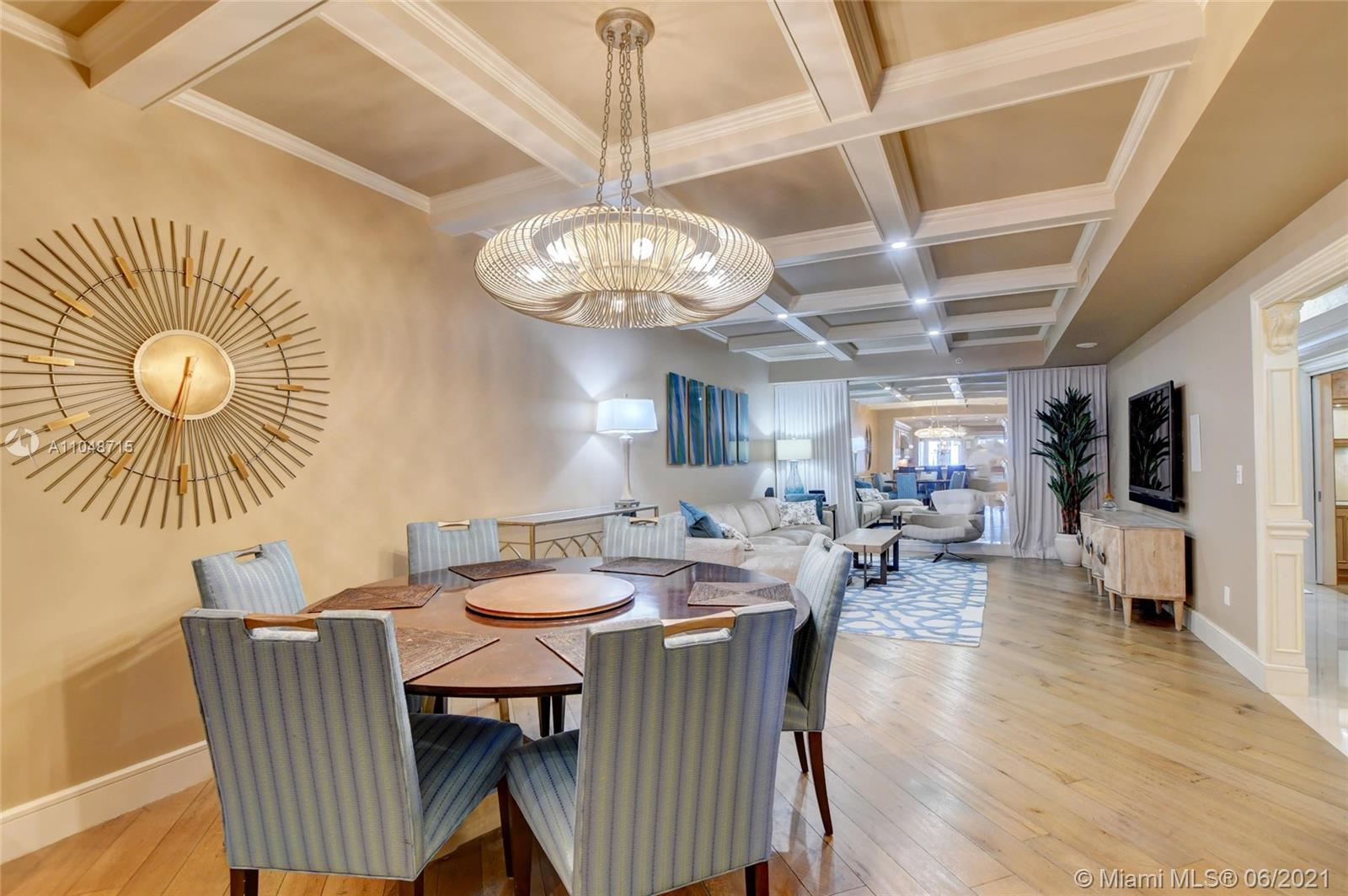 2500 South Ocean Boulevard, Unit 702 Boca Raton, FL 33432 - Photo 23 of 61 a view of a dining room with furniture wooden floor and a chandelier