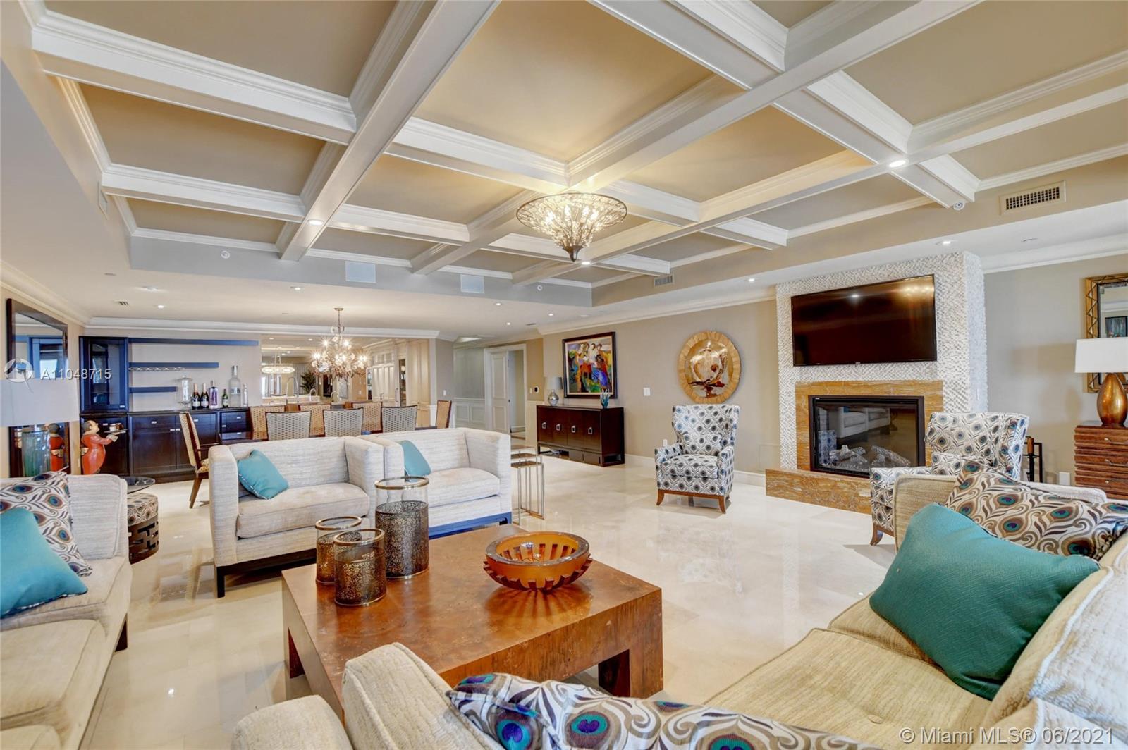 2500 South Ocean Boulevard, Unit 702 Boca Raton, FL 33432 - Photo 25 of 61 a living room with furniture large window and fireplace