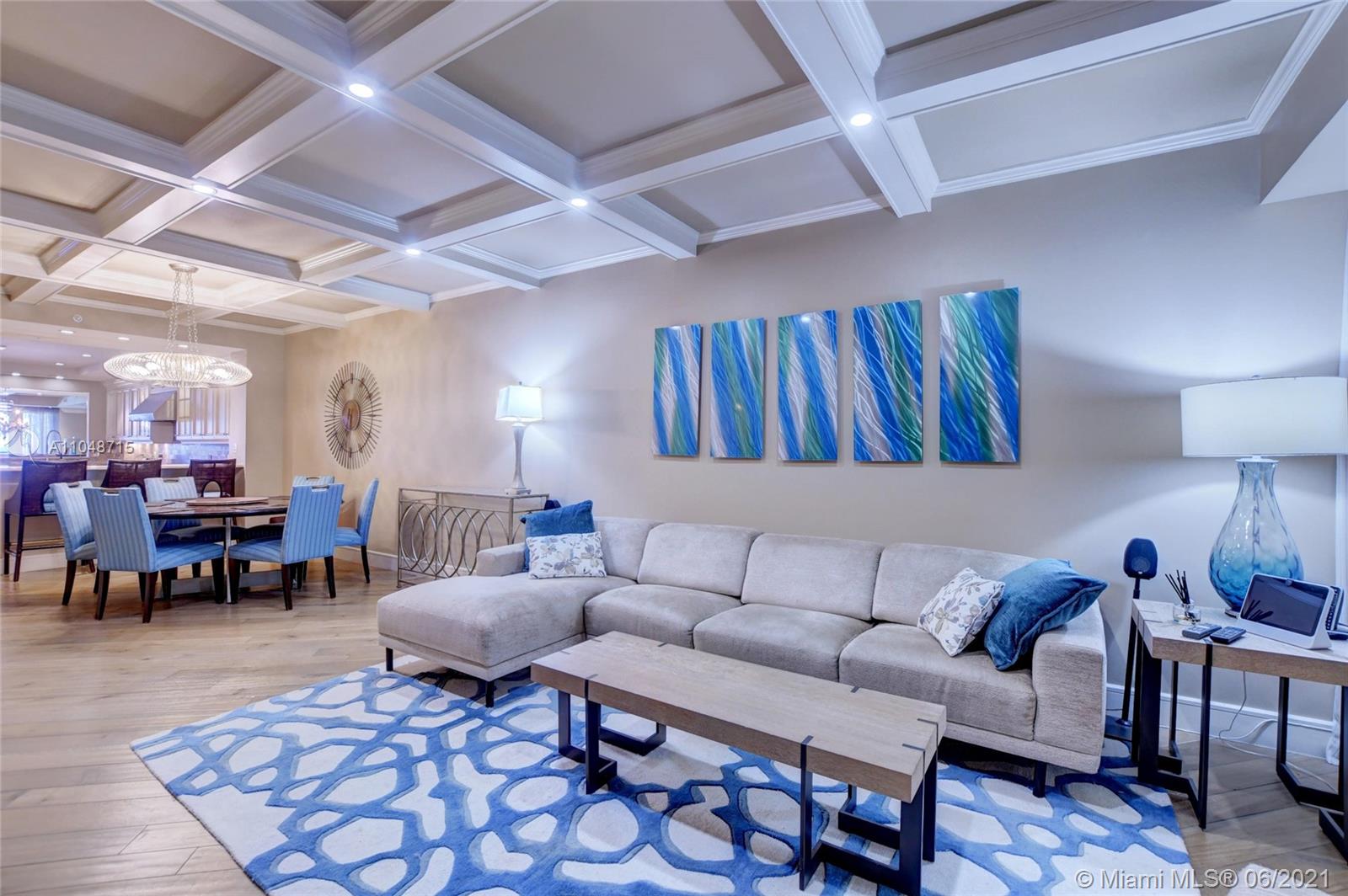 2500 South Ocean Boulevard, Unit 702 Boca Raton, FL 33432 - Photo 26 of 61 a living room with furniture a rug and a table